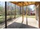 Covered brick patio offering space to relax with a backyard view at 916 Rollingwood Dr, Mount Holly, NC 28120