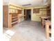 Workshop with built-in shelves, ample storage, and a concrete floor at 916 Rollingwood Dr, Mount Holly, NC 28120