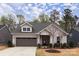 Charming single-Gathering home with a two-car garage and well-manicured landscaping at 938 Moose Trl, Matthews, NC 28104