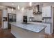 Modern kitchen with stainless steel appliances, granite countertops, and a stylish backsplash at 938 Moose Trl, Matthews, NC 28104