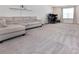 Open living room with carpet, a gray sectional sofa, and a window at 938 Moose Trl, Matthews, NC 28104