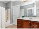 Cozy bathroom with a shower-tub combo, vanity with storage, and a mirror reflecting a well-lit space at 9832 Sunriver Rd, Huntersville, NC 28078