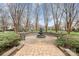 Picturesque courtyard featuring a fountain, benches, and lush greenery for serene outdoor enjoyment at 9832 Sunriver Rd, Huntersville, NC 28078