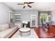 Inviting living room with hardwood floors, fireplace, and plenty of natural light at 9832 Sunriver Rd, Huntersville, NC 28078