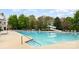 Large community swimming pool with a slide and plenty of seating for residents to enjoy the outdoors at 9832 Sunriver Rd, Huntersville, NC 28078