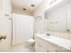 Clean bathroom with white fixtures, striped wallpaper, and a shower with a curtain at 106 Jason Ct, Fort Mill, SC 29715