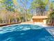 A spacious community pool is surrounded by trees and amenities, offering residents a place to relax at 106 Jason Ct, Fort Mill, SC 29715