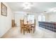 Cozy dining area with natural light, ceiling fan, and access to outdoor space at 106 Jason Ct, Fort Mill, SC 29715