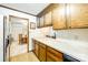A kitchen with wood cabinets and a view into the dining room at 106 Jason Ct, Fort Mill, SC 29715