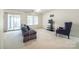 Bright living room with comfortable seating and sliding glass doors to the outside at 106 Jason Ct, Fort Mill, SC 29715