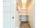 Storage room featuring built-in shelving, a painted cement floor, and secure storage space at 106 Jason Ct, Fort Mill, SC 29715