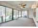 Sunroom with multiple sliding glass doors leading to an outdoor deck with railing at 106 Jason Ct, Fort Mill, SC 29715