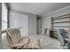 Spare bedroom with closet, bookshelf, accent chair, and neutral walls creating a versatile space at 10728 Bere Island Dr, Charlotte, NC 28278