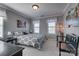 Charming bedroom with decorative lamps, neutral walls, and carpet, creating a cozy and inviting space at 10728 Bere Island Dr, Charlotte, NC 28278
