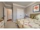 Cozy bedroom featuring carpeted floors, a double door closet, and pleasant decor for restful nights at 10728 Bere Island Dr, Charlotte, NC 28278