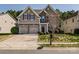 Charming two-story home with brick accents, a two-car garage, and well-maintained landscaping at 10728 Bere Island Dr, Charlotte, NC 28278
