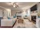Bright living room with hardwood floors, a cozy fireplace, and stylish furnishings at 10728 Bere Island Dr, Charlotte, NC 28278