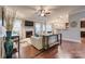 Spacious living room features hardwood floors, a fireplace, and seamless flow to the kitchen at 10728 Bere Island Dr, Charlotte, NC 28278