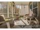 Relaxing screened porch with comfortable seating and stylish decor at 10728 Bere Island Dr, Charlotte, NC 28278