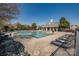 Inviting community swimming pool with ample lounge chairs and manicured surroundings at 10728 Bere Island Dr, Charlotte, NC 28278