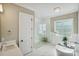 Elegant bathroom featuring a freestanding tub, glass-enclosed shower, and stylish fixtures at 109 Redbird Ln, Weddington, NC 28104