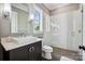 Modern bathroom featuring a glass-enclosed shower, a sleek vanity, and contemporary fixtures at 109 Redbird Ln, Weddington, NC 28104