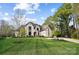 Stunning two-story home with a well-maintained lawn, mature trees, and a welcoming entrance, showcasing curb appeal at 109 Redbird Ln, Weddington, NC 28104
