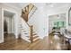 Welcoming foyer with hardwood floors and staircase leading to the upper level at 109 Redbird Ln, Weddington, NC 28104