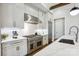 Contemporary kitchen with stainless steel appliances, white cabinets, and a large island at 109 Redbird Ln, Weddington, NC 28104
