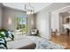 Elegant living room featuring stylish furniture, natural light, and a view of the lush outdoors at 109 Redbird Ln, Weddington, NC 28104