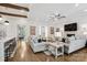 Open living room with access to the kitchen, neutral decor, and hardwood floors at 109 Redbird Ln, Weddington, NC 28104