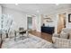 Loft area with a stylish desk, wet bar, and natural light, perfect for a home office or entertainment space at 109 Redbird Ln, Weddington, NC 28104