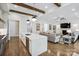 Bright, open floor plan with a kitchen island overlooking the living room and fireplace at 109 Redbird Ln, Weddington, NC 28104