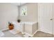 Bathroom with a soaking tub, tile floors, and neutral walls at 11222 Huntington Meadow Ln, Charlotte, NC 28273