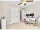 Bedroom featuring light walls, neutral carpet, a ceiling fan, and a desk with two computer monitors at 11222 Huntington Meadow Ln, Charlotte, NC 28273