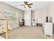 Bedroom featuring light walls, neutral carpet, a ceiling fan, and various toys at 11222 Huntington Meadow Ln, Charlotte, NC 28273