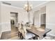 Comfortable dining room featuring a wooden table with decorative chairs and view into the kitchen at 11222 Huntington Meadow Ln, Charlotte, NC 28273