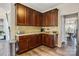 Functional kitchen with dark wood cabinets, granite countertops, and stainless steel appliances at 11222 Huntington Meadow Ln, Charlotte, NC 28273