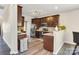 Practical kitchen featuring stainless steel appliances, granite countertops, and ample dark wood cabinetry at 11222 Huntington Meadow Ln, Charlotte, NC 28273