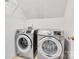 Efficient laundry room with front loading washer and dryer and ample space at 11222 Huntington Meadow Ln, Charlotte, NC 28273