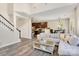 Inviting living room with hardwood floors leading to an open-concept kitchen and staircase at 11222 Huntington Meadow Ln, Charlotte, NC 28273