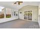 Relaxing screened porch with ceiling fan and sliding glass doors at 11222 Huntington Meadow Ln, Charlotte, NC 28273