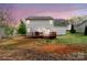 This home features a spacious backyard with a deck and beautiful sunset at 11415 Serenity Way, Charlotte, NC 28269