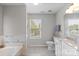 This bathroom features modern fixtures, vanity and lots of light at 11415 Serenity Way, Charlotte, NC 28269