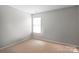 Bedroom showing bright natural light from the large window at 11415 Serenity Way, Charlotte, NC 28269
