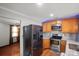 Bright kitchen with stainless steel appliances and granite countertops offers a modern feel at 11415 Serenity Way, Charlotte, NC 28269