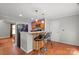 Eat-in kitchen features a breakfast bar and updated stainless steel appliances at 11415 Serenity Way, Charlotte, NC 28269