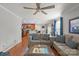 Open-concept living room with hardwood floors and a seamless transition to the modern kitchen at 11415 Serenity Way, Charlotte, NC 28269