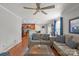 Open-concept living room with hardwood floors and a seamless transition to the modern kitchen at 11415 Serenity Way, Charlotte, NC 28269
