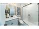 This bathroom features sleek, black fixtures, a stand-up shower, and decorative tile flooring at 118 Fordingbridge Ln, Mooresville, NC 28115